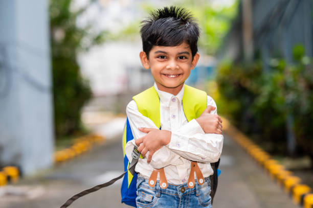 Back to school concept- Little boy going to school with his school bag. Education for children.